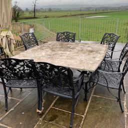 Heavy weight outdoor table with 8 chairs. ONO.