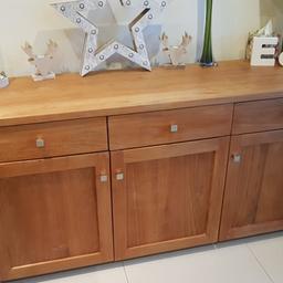 Solid Oak sideboard with 3 drawers and cupboards with shelves. Good used condition. Originally purchased from Harleys Interiors Chesterfield. Collection only.