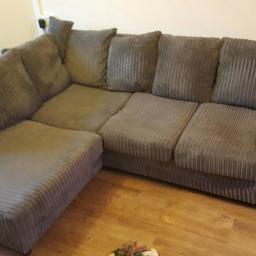 grey cord corner sofa. used but in good condition. cats scratch the arm hence reduced price. buyer to collect need gone by Wednesday - £30 ono.