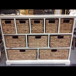 Storage Drawer unit with 9 straw drawers.  The drawers could be replaced with any basket or plastic storage boxes. In good condition, except 1 of the drawers has a hole in the straw. ( see pictures). It is 101cm wide, 74 cm high & 38 cm deep.  We are near Capel.