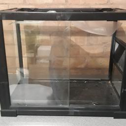glass vivarium with sliding doors. the mesh on the lid fell through when my cat decided to sit on it. this is fixable but I don't have the time or the need to fix it.
the floor has a crack in it but it hasn't gone all the way through 
free to anyone who wants it