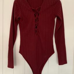 Burgundy boohoo body suit in size 8. Excellent condition and very comfortable to wear. Only been worn a couple of times. Comes from a pet and smoke free home.