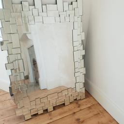 This Dwell mirror uses mosaic tiles to create an irregular inner and outer edge to the mirror's frame. The effect of this distorted boundary is an amorphous appearance that allows the mirror to integrate beautifully with any surface in your home. RRP £249

Chipped in corner: refer to pictures

Dimensions
h90cm : w120cm : d4cm

Collection only from SW18