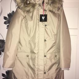 Brand new with tags never worn size 20 lovely beige colour coat water proof with hood