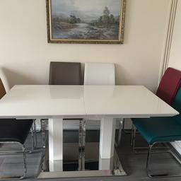 In very good condition.comes with 6 chairs in excellent condition.sit up to 8 people.only selling as my new flat is small.