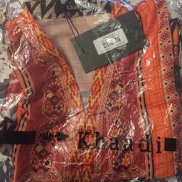 Beautiful Khaadi Kurta top is new with tags and pure silk and 100% genuine. It is size 10. Uk mainland and worldwide bidders ............ Original item not copy ..... Any questions pls ask..... No time wasters Pls thank you.......Only taken out to take photos, comes new and unworn
