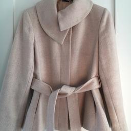Lovely soft pale pink wool mix coat from Autograph at M&S.
Can be worn with buttoned up asymmetric neck or open neck. Comes with belt.
Excellent used condition.
Size 14.