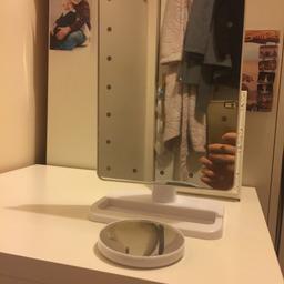 Personal Mirror with Touchscreen Lights. Come with circle close up mirror which is detachable. Battery powered, with on/off switch. Perfect condition.