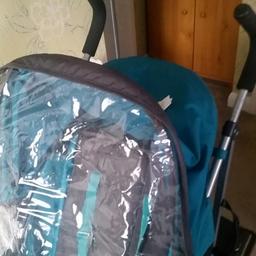 mamas and papas with matching rain cover and foot muffin.  the seat lays right back for newborn. large basket. including buggy board