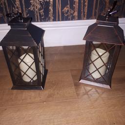 Two lanterns with candles