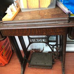 Singer sewing machine in table with treadle mat!! Im not sure if it works. Some wear and tear open to sensible offers