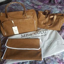 New brown baby changing bag with labels

