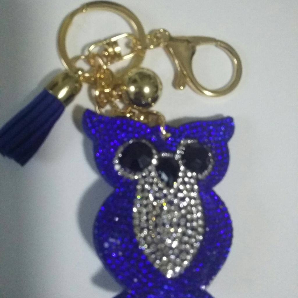royal blue keyring with stones,all is in mint condition, in packaging and never used
