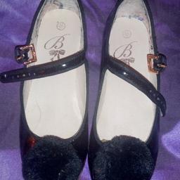in immaculate condition are my daughter's genuine Ted baker (baby baker) pom pom shoes. in size 12 or EU(31), these are black patent with the Ted baker logo sign on the back in a tidy gold button with straps and gold buckle. sadly outgrown after only purchasing or Christmas she wore Christmas day and says they now hurt. paid £48 for these after the 20% off so there expensive. I have box but no bag. I can post but collection preferred.