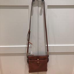 Tan side bag with adjustable strap.
Secure inside pocket with zip and secure pocket on front with a buckle. 
Used but in great condition.