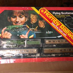 Hornby flying scottsman in great working condition comes with a platform a building and a tunnel some track in original box control needs repairing