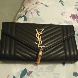 Black leather YSL clutch bag with chain handle to have it over the shoulder

never been used
IMMACULATE CONDITION
£20 ONO