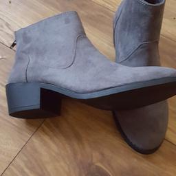 Brand new boots with small heel.