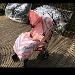 Currently being washed. Comes with cosy toes, baby changing bag and rain cover. The rain cover has a slight tear in it. But doesn’t effect the use.