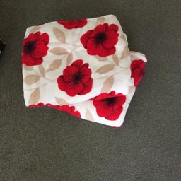 2 poppy throws. On a cream background with red poppies and beige coloured leaf . 66 inches by 77 inches. As new condition. Will separate for £5 .