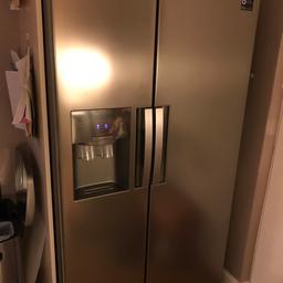 American style fridge freezer in brushed steel. Dispenses ice and filtered water. External inline filter. Ice can be crushed or cubed. Good condition with a couple of very small dents hardly noticeable.