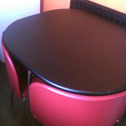 black table and four red chairs chrome legs collection howdon ne28 Ody Good condition