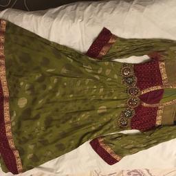 Mehndi green suit has been worn once.
Lovely fitted suit it’s small/medium suit. 
Comes with a shalwar and dupatta. 
Delivery and collection both an option