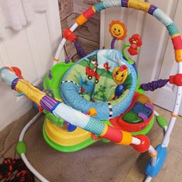 babys jumparoo with different toys to play with. even the seat turns around in gd condition from a clean home