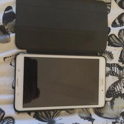 White Galaxy Tab 4 Tablet. Perfect condition and in great working order. Comes with charger cable, plug and purple leather case. 16GB. Comes from a pet and smoke free home.