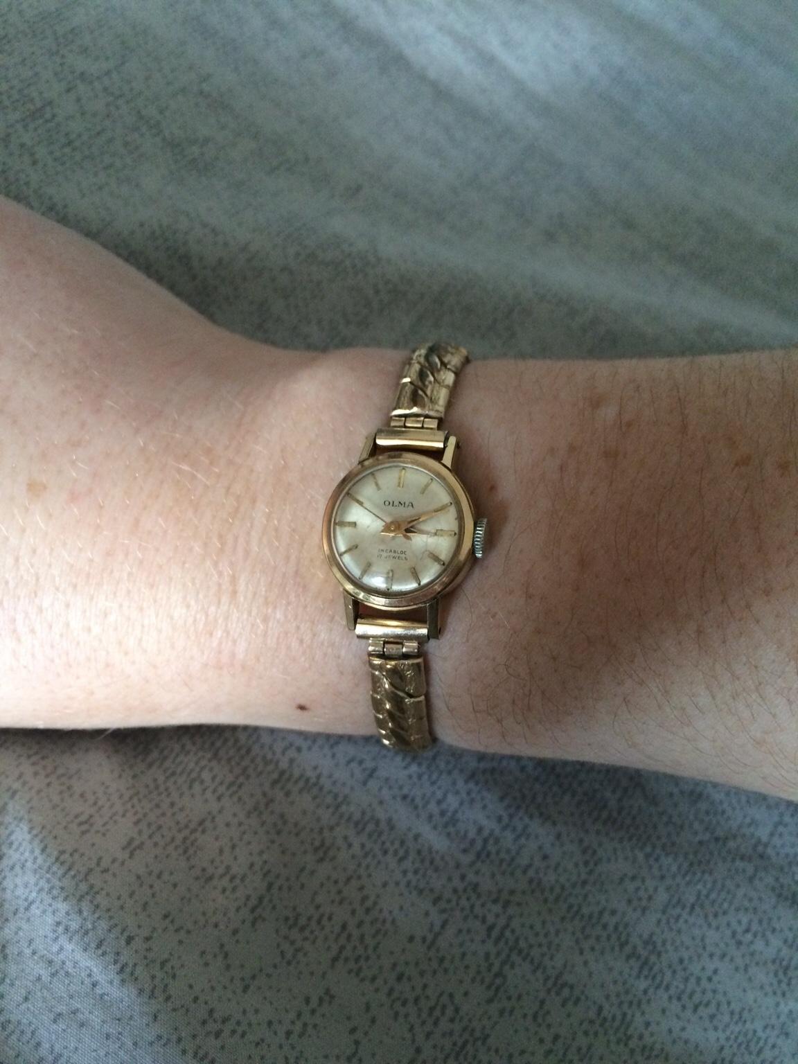 olma ladies gold watch