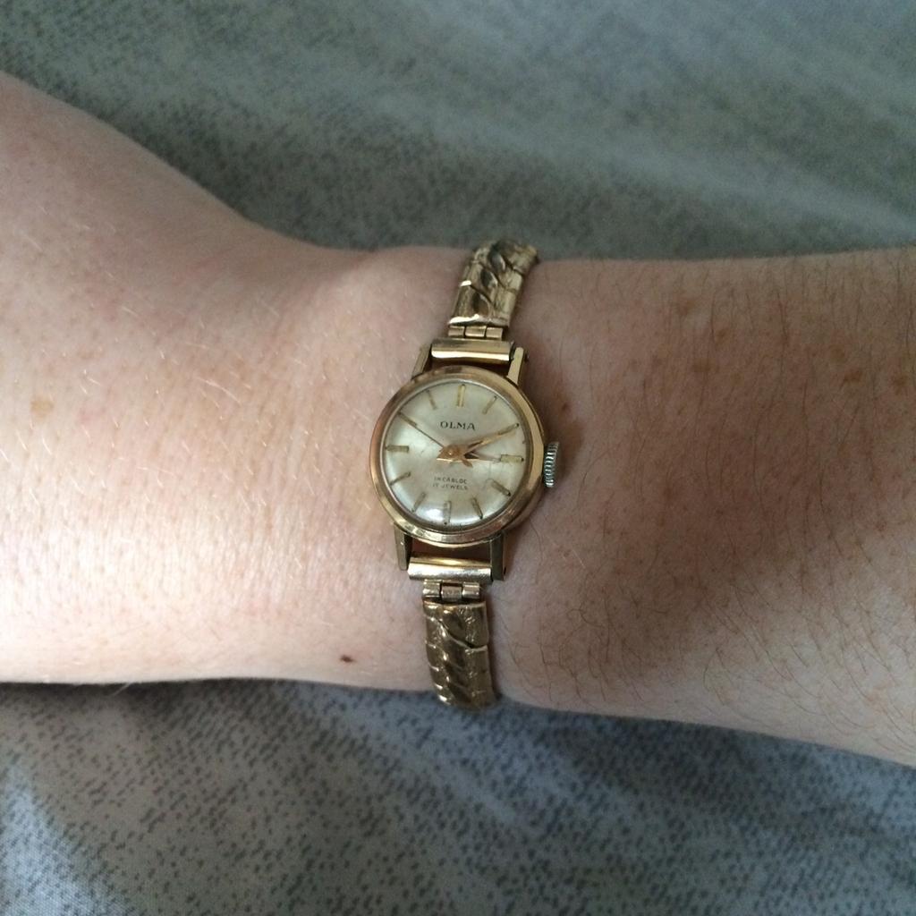 Olma shop gold watch