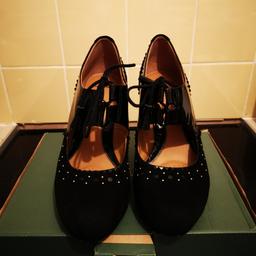 Leather  and black paitant shoes only worn once for a wedding size 6.5 softwear so they are very comfortable, heel size 2.5 inch. Stud pattern all the way round the shoe. Pick up only or could deliver if not too far away.