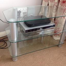 Glass and silver TV stand.
80cm wide, 53cm high, 45cm deep.
Small chip on bottom shelf otherwise in good condition.

Collect only.