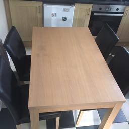 Table and 4 chairs. 2 chairs are slightly worn has shown in pictures