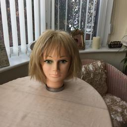 Mousy blonde bob wig. Cream Lacey netting inside with fasteners to tighten.in good condition as not worn much as am not a blonde. Synthetic hair. Does not include head.