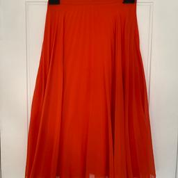 Blood orange pleated skirt in size 8, worn a few times but still in excellent condition. Comes from a pet free and smoke free home.