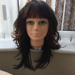 Chocolate brown long wavy wig with copper highlights. Good condition. Not worn much. Lacy netting inside with fasteners to tighten.does not include head. 