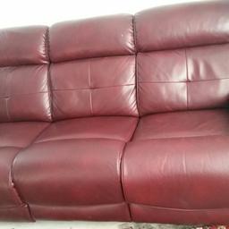Burgundy 3 piece suite. 3 Seater sofa and 2 Chairs all with manual recliners. Good condition slight wear on arm rests.
