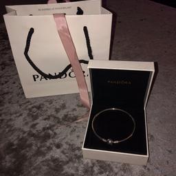 Gorgeous pandora bangle brand new never worn, lost receipt so I cannot return item. Bagel comes as pictured in original box and bag. Collect or will post for cost of postage. Thanks
