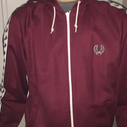 Maroon Fred Perry jacket/hoodie zip up. Taped logo down the arms. Immaculate condition. Size small. Cost £80 in jd sports. Selling at £35 ono.