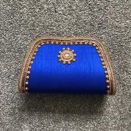 Blue clutch bag with antique gold detailing.
Perfect condition. Never been used. 
Cash only. Collection only.