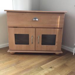Light wood TV / Media Unit. 
Versatile unit with shelf space and useful storage cupboard underneath. Substantial piece of furniture not flat pack