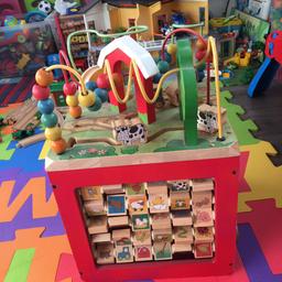 Little doors, drop spiral thing, alphabet and pictures, matching animals section and moving wooden animals on top section .