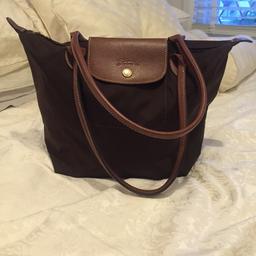 Small brown le pilage longchamp bag. It has been rarely used and in excellent condition as seen in the pictures. Can be posted