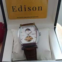 brand new in box.automatic watch with leather strap.£90