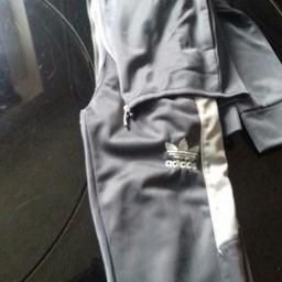 Grey Tracksuit aged 3-4 years. in good condition. Also have another in black and white, same size