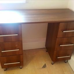 OFFERS WELCOME.
Pick up only from CH41, as I have no car! Will help you carry it & pack into car if needed though. 😊

This is a lovely modern desk with 6 spacious drawers, metal handles all in a dark wood.

There is a slight mark on 1 drawer (as pictured) but this is from tape when moving and will most likely come off with a little elbow grease! Otherwise in very good condition.