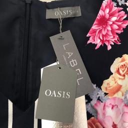 This item has never been worn and still has the tags on. Size 10 with original belt from oasis.