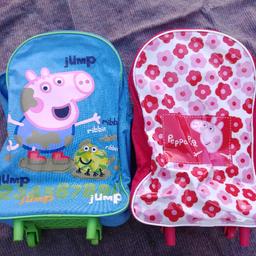 2x wheeled cases with extendable handles. 
1x peppa bag (has pen mark inside)
£10 for it all
