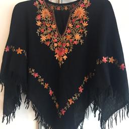 Black with floral embroidery 
Size Small 
Postage extra £2.95